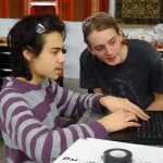Evan and Isaiah working on programming.